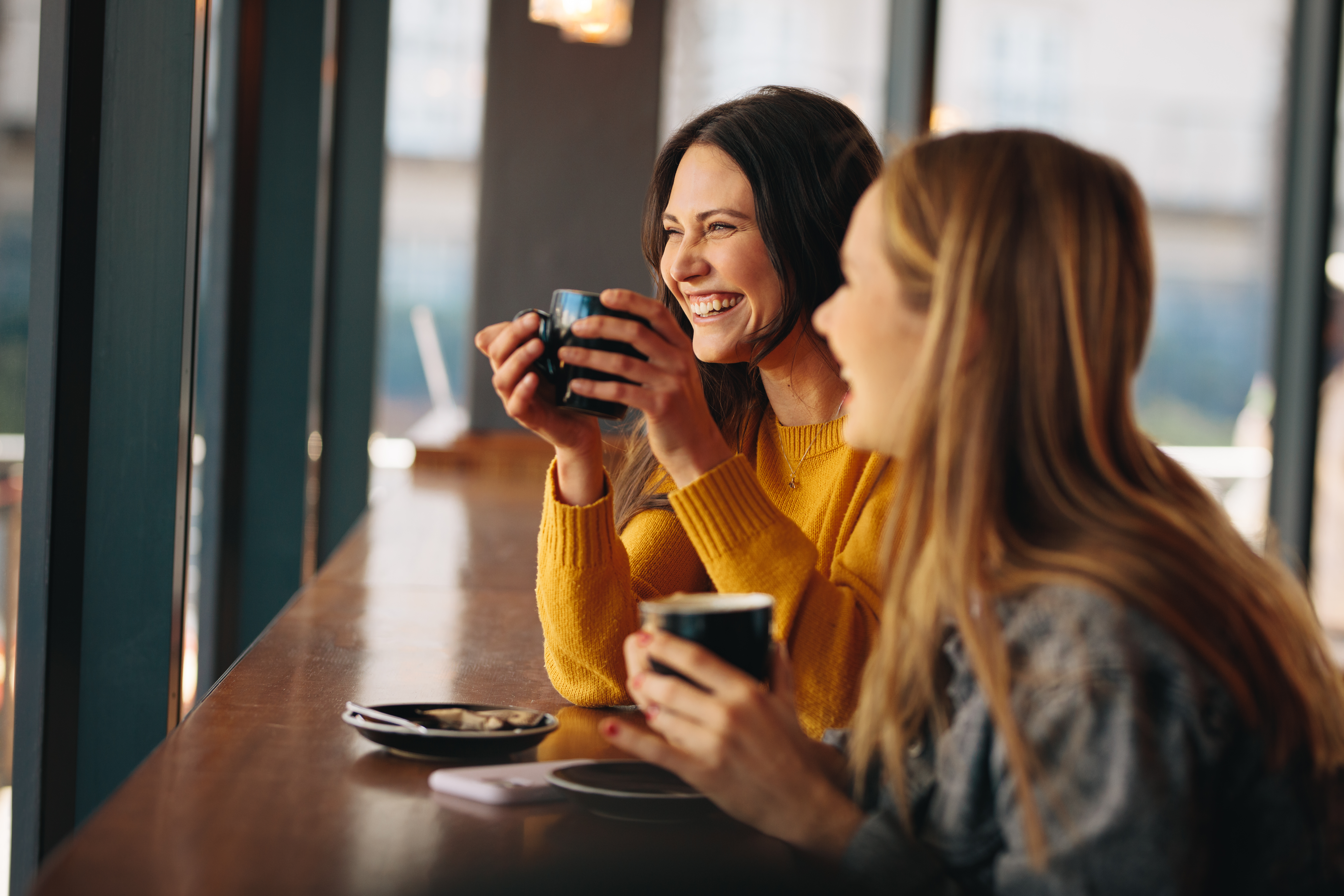 two woman laughing